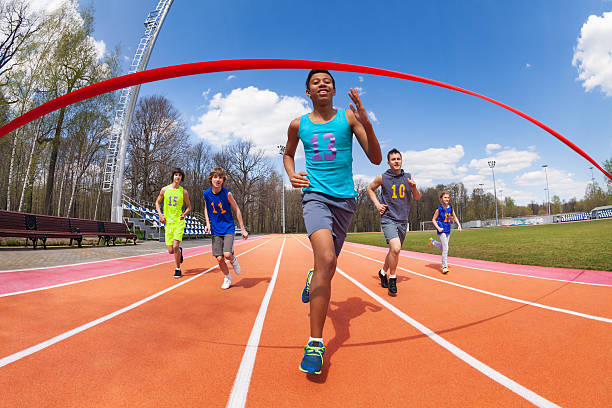 istock Happy African sprinter running to the finish line 583848744