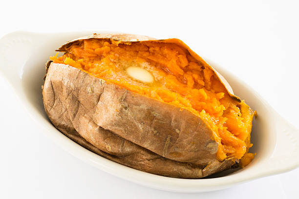 istock baked sweet potato with butter 583850856