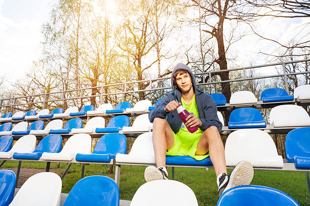 istock Teenage athlete having rest after working out 583853374