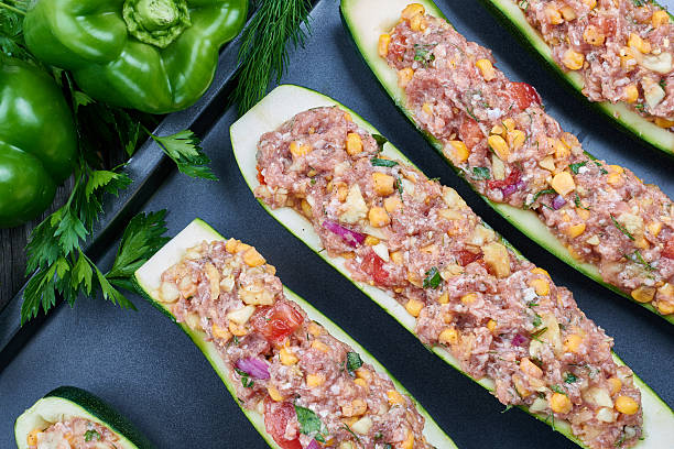 istock Raw courgettes stuffed with meat and vegetables 583854018