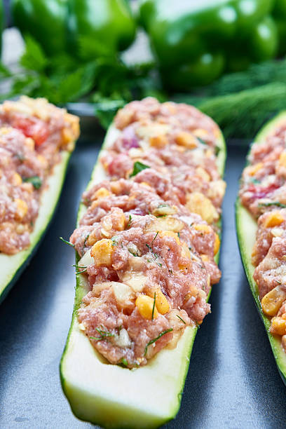 istock Raw courgettes stuffed with meat and vegetables 583854054