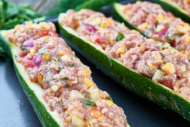 istock Raw courgettes stuffed with meat and vegetables 583854092