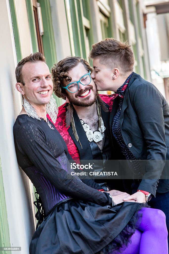 Kiss Among Three Gender Fluid Friends Stock Photo - Download Image Now ...