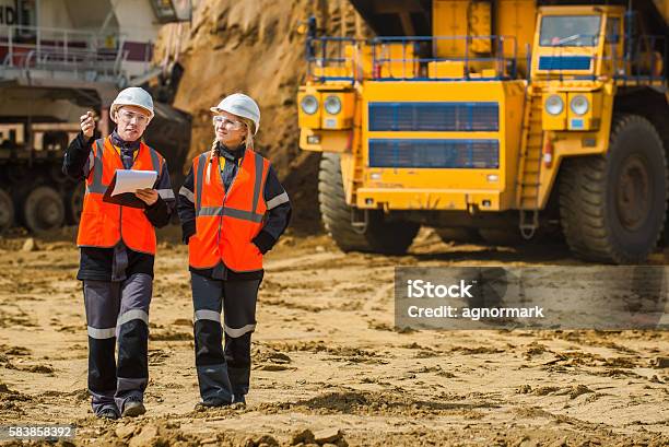 Two People Working Stock Photo - Download Image Now - Mining - Natural Resources, Miner, Engineer