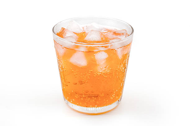 istock orange soda with Ice in a glass 583858520