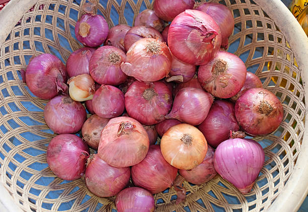 istock Red onions in basket 583859316