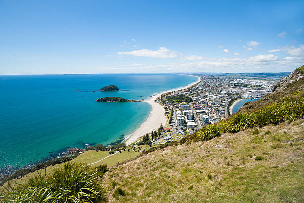istock Long white beach of Mount Maunganui 583859504