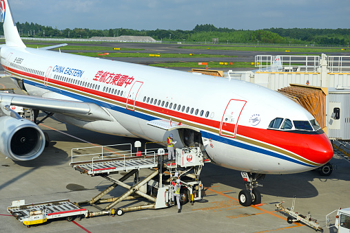 Tokoname, Japan - December 25, 2023 : Shanghai Airlines Boeing 737-800 at the Chubu Centrair International Airport in Tokoname City, Aichi Prefecture, Japan.