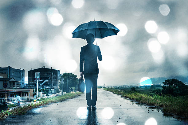 istock businessman are holding an umbrella, dark image 583861906