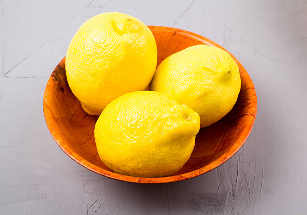 istock Lemons in a wooden bowl 583958930