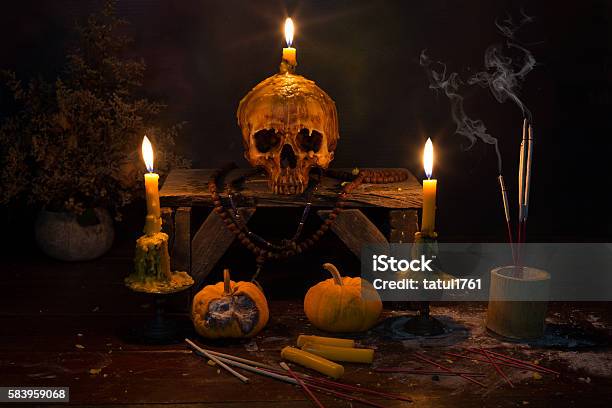 Skull With Candle Light In The Dark Night Stock Photo - Download Image Now - Ash, Awe, Backgrounds