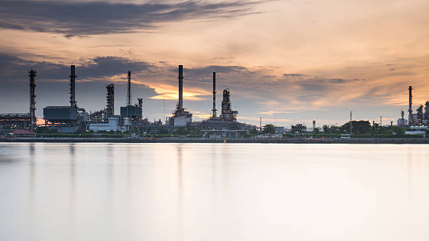 istock Oil refinery Riverside and Water reflection 583959454