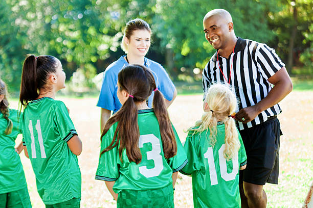 istock Youth soccer referee explains game rules to players 583960458