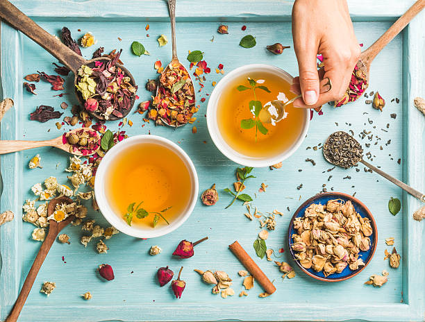istock Two cups of healthy herbal tea with mint, cinnamon, dried 583963524