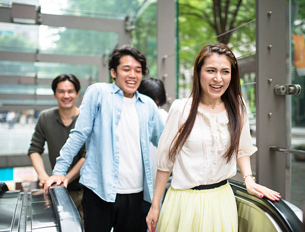 istock japanese friends happiness on the elevators 583966624