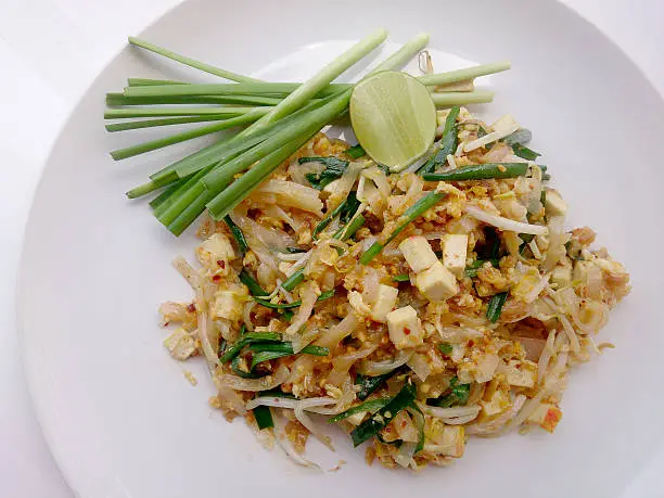 Photo of Pad Thai, stir-fried rice noodles with tofu. Vegetarian Food,