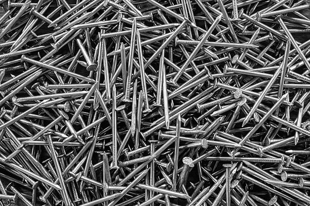 istock Group of nails and screw background. Black and white color 583968400