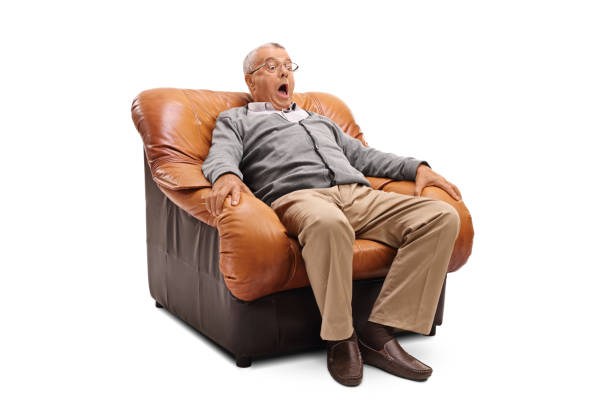 istock Scared senior sitting on an armchair 583968794
