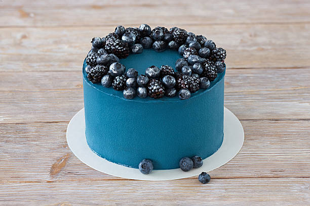 istock Blue cake with blueberry and blackberry 583969328
