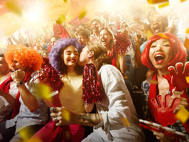 istock Sport fans: Man kisses woman 583970722
