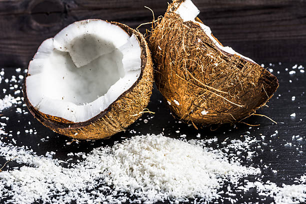 istock Two halves of coconut macro 583971054