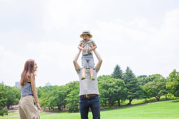 istock Children riding on his father's shoulder 583971432