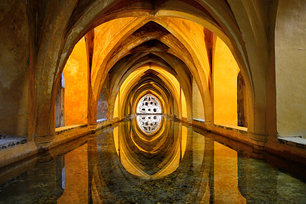 queen's baths, alcazar of seville - ancient arabic style arch architecture imagens e fotografias de stock