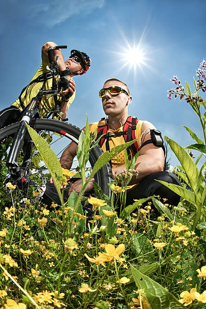 Riding mountain bike in the beautiful flowering grassland mountains