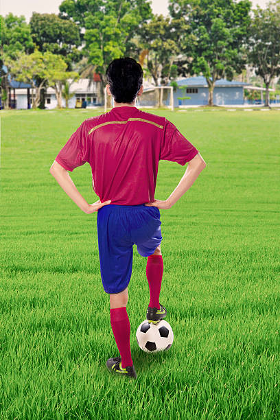 istock Soccer player with ball at the field 583973482