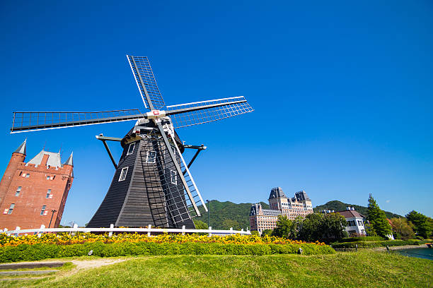 Windmill at Huis Ten Bosch stand in a bright and clear sky, Japan