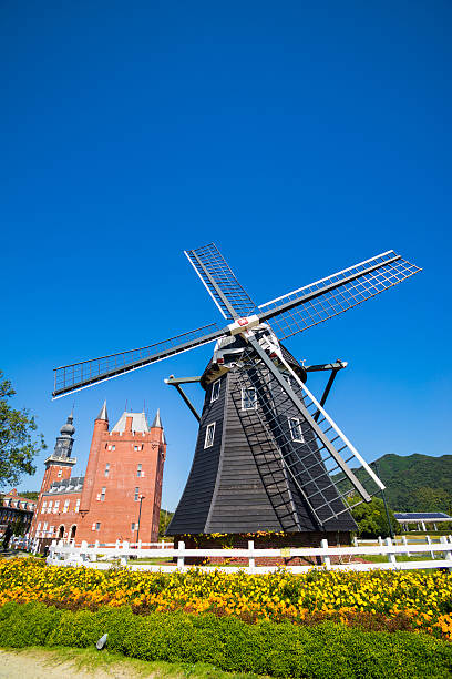 Windmill at Huis Ten Bosch stand in a bright and clear sky, Japan