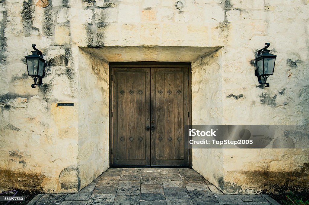 Closed old door on the wall of The Alamo Alamo - San Antonio Stock Photo