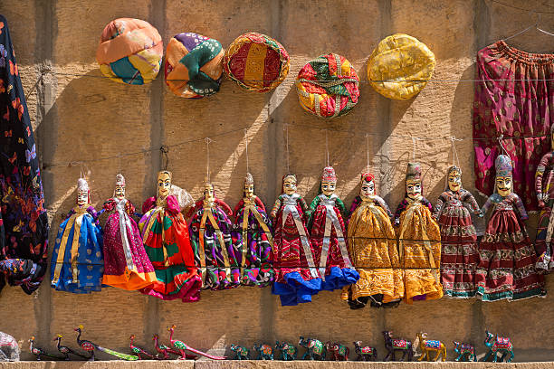 Souvenir Rajasthan puppets hanging in the street shop stock photo