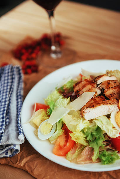 istock Caesar salad with croutons, quail eggs, cherry tomatoes 583982036