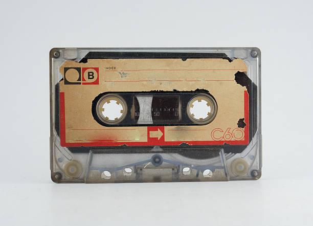 old audio tape on white background - clock hand audio imagens e fotografias de stock