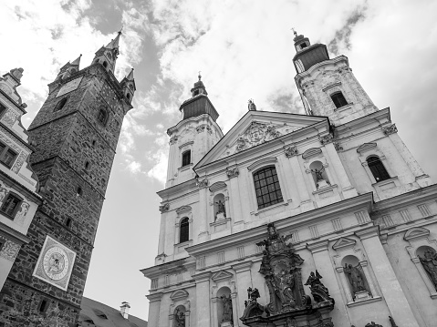 Black Tower and The Church of Virgin Mary's Immaculate Conception and St. Ignatus in Klatovy, Czech Republic . Black and white image.