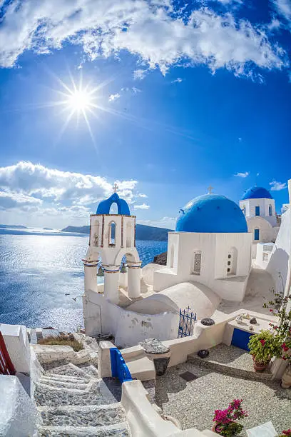 Photo of Oia village in Santorini island with famous churches,  Greece