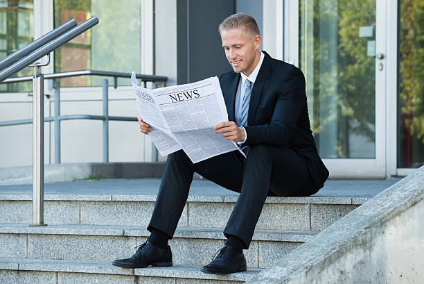 istock Businessman Reading Newspaper 583984892