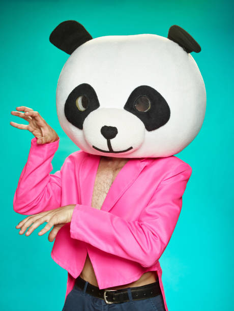 istock The guy in pink tailcoat with panda head. 583985238