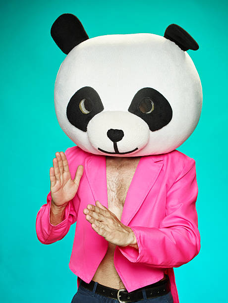 istock The guy in pink tailcoat with panda head. 583985658