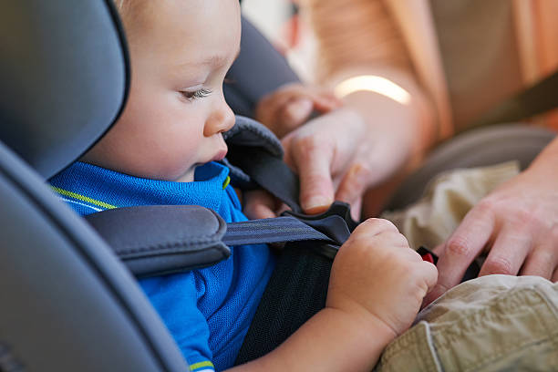 istock Ensuring he's safely fastened in the seat 583986300