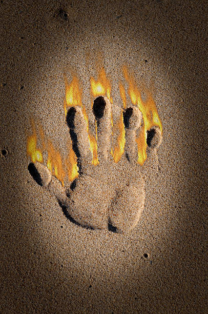 Handprint on fire stock photo