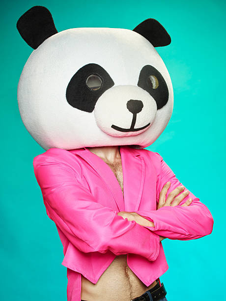 istock The guy in pink tailcoat with panda head. 583987086