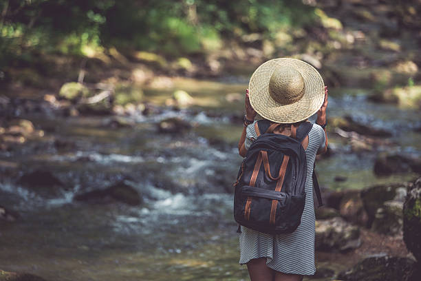 istock Girl and the mountain river 583987316