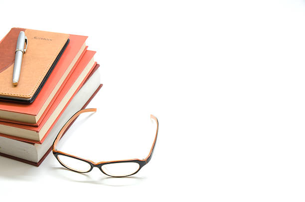 istock Notebook,books and glasses on white background 583987334