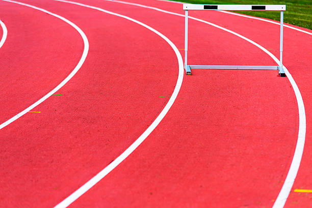 istock red race track and hurdle in athletic lines 583987552