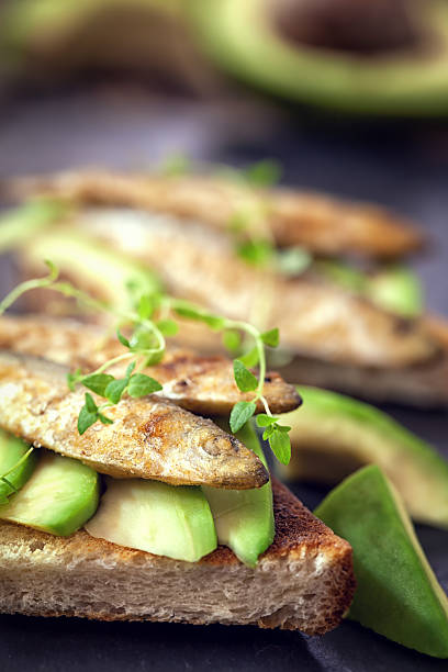 istock Sandwich with sprats and avocado 583988214