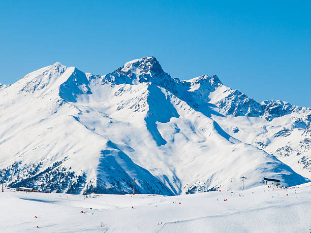 istock Sunny winter day in alpine ski resort 583988482