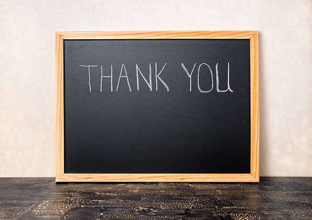 istock handwriting text thank you is written in chalkboard 583989030