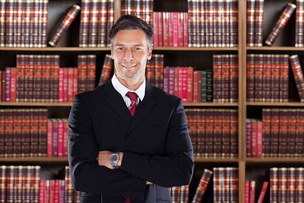 istock Confident Mature Attorney Standing With Arms Crossed 583989630